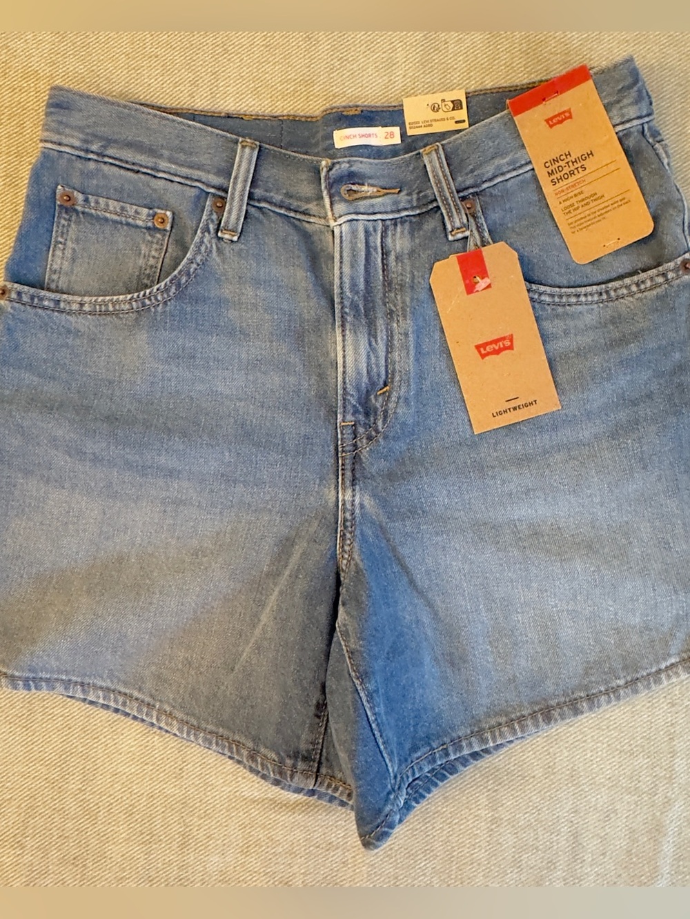 Levi's • Cinch Mid-thight shorts.